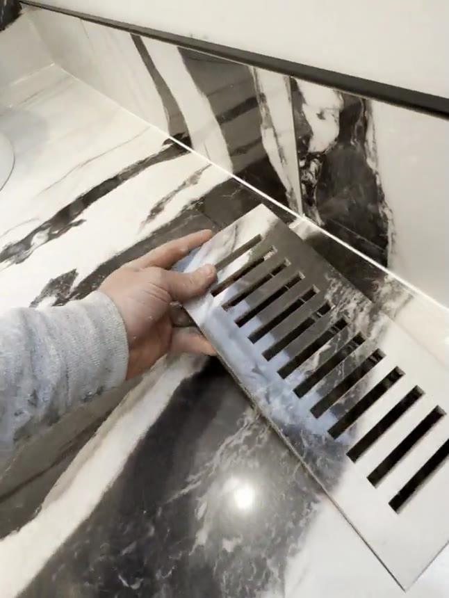 Panda marble-look porcelain bathroom renovation by Burlington Tile.